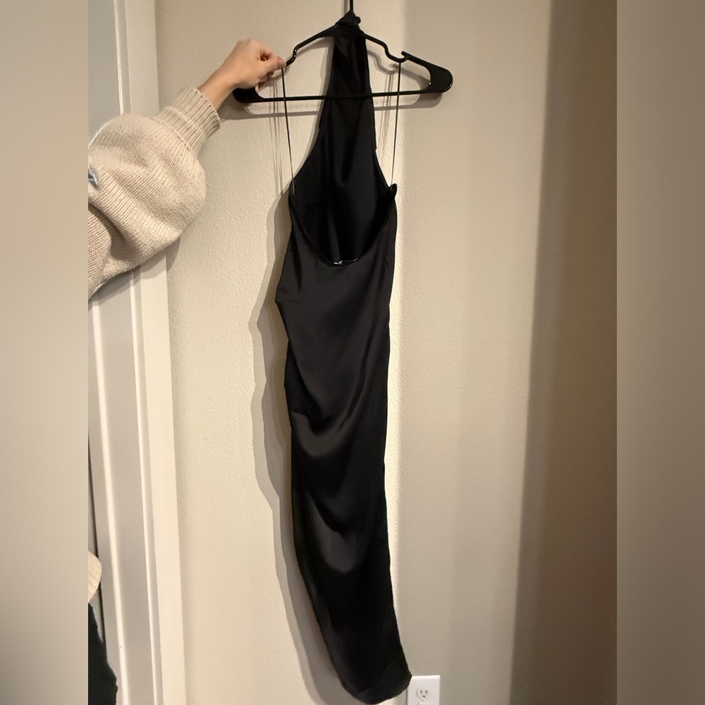 Black halter dress, midi, with slit in side.